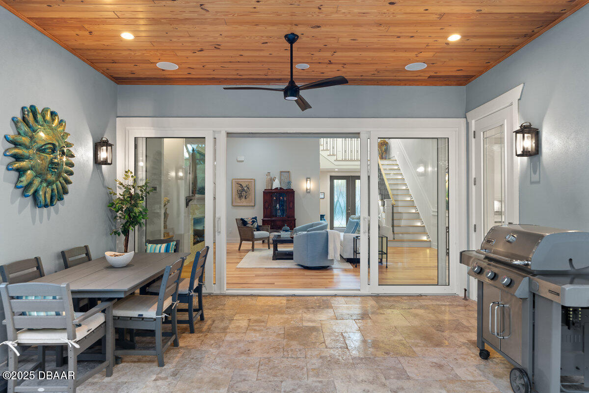 54 Ocean Way Drive Ponce Inlet, FL 32127 - Photo 52 of 76 a dining room with furniture and wooden floor