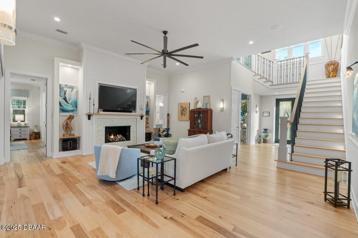 54 Ocean Way Drive Ponce Inlet, FL 32127 - Photo 7 of 76 a living room with furniture a fireplace and a flat screen tv