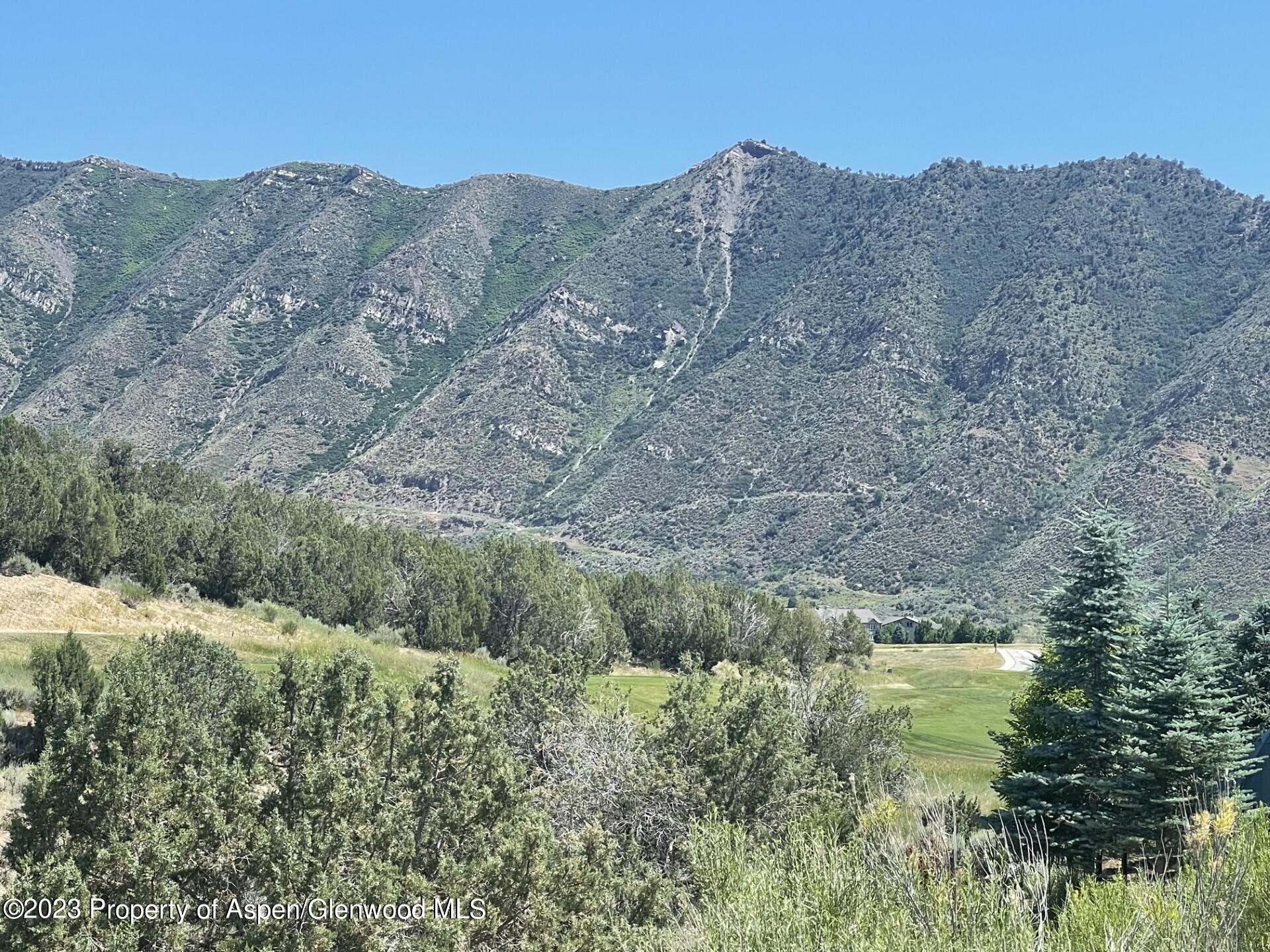a view of a mountain range with trees
