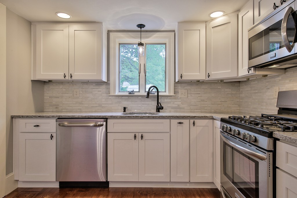 619 Main Street Boxford, MA 01921 - Photo 1 of 29 a kitchen with stainless steel appliances granite countertop a sink stove and cabinets