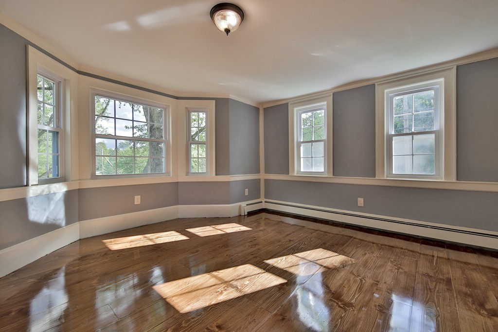 619 Main Street Boxford, MA 01921 - Photo 12 of 29 a view of a livingroom with wooden floor and furniture