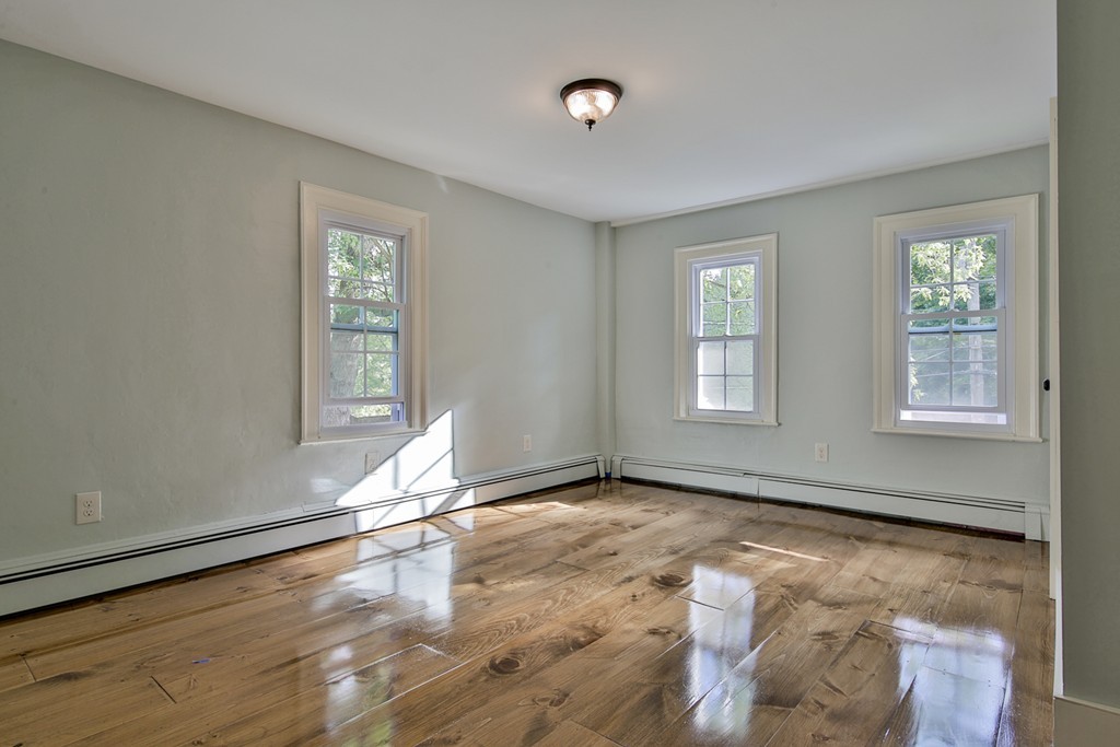 619 Main Street Boxford, MA 01921 - Photo 13 of 29 a view of empty room with wooden floor and fan