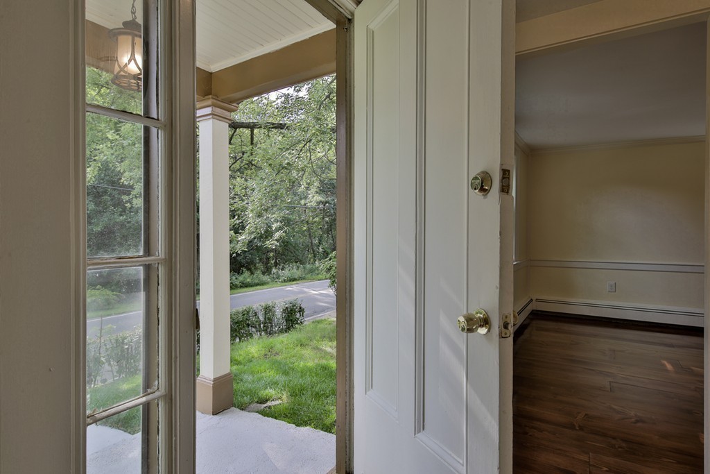 619 Main Street Boxford, MA 01921 - Photo 15 of 29 a view of a glass door and porch