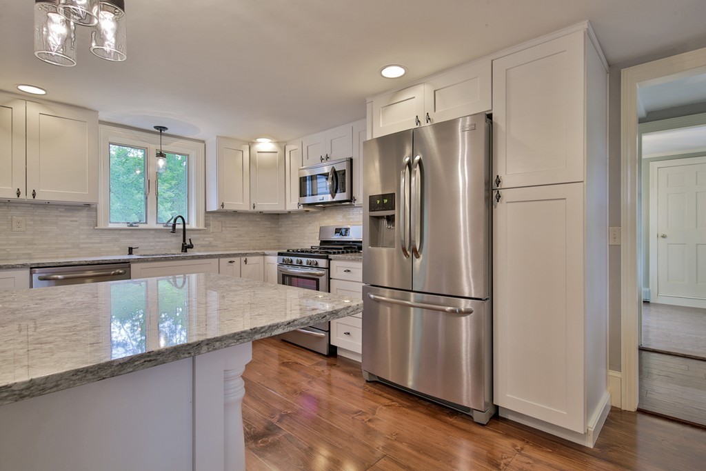 619 Main Street Boxford, MA 01921 - Photo 2 of 29 a kitchen with stainless steel appliances granite countertop a refrigerator and a sink