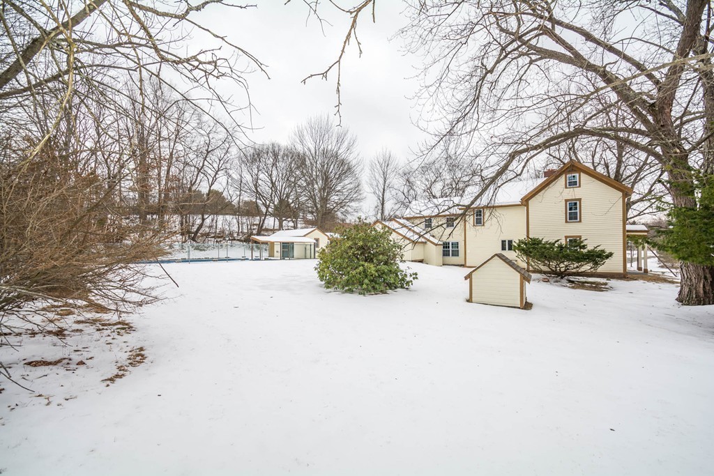 619 Main Street Boxford, MA 01921 - Photo 28 of 29 a view of a white house with a yard