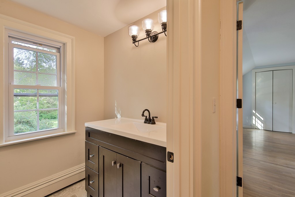 619 Main Street Boxford, MA 01921 - Photo 8 of 29 a bathroom with a sink and a mirror