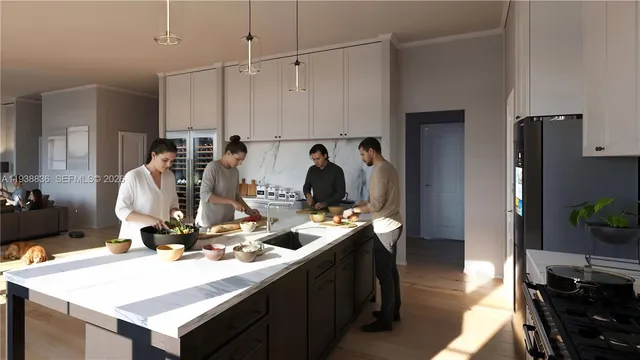 a view of a kitchen with kitchen island a stove a refrigerator and a dining table