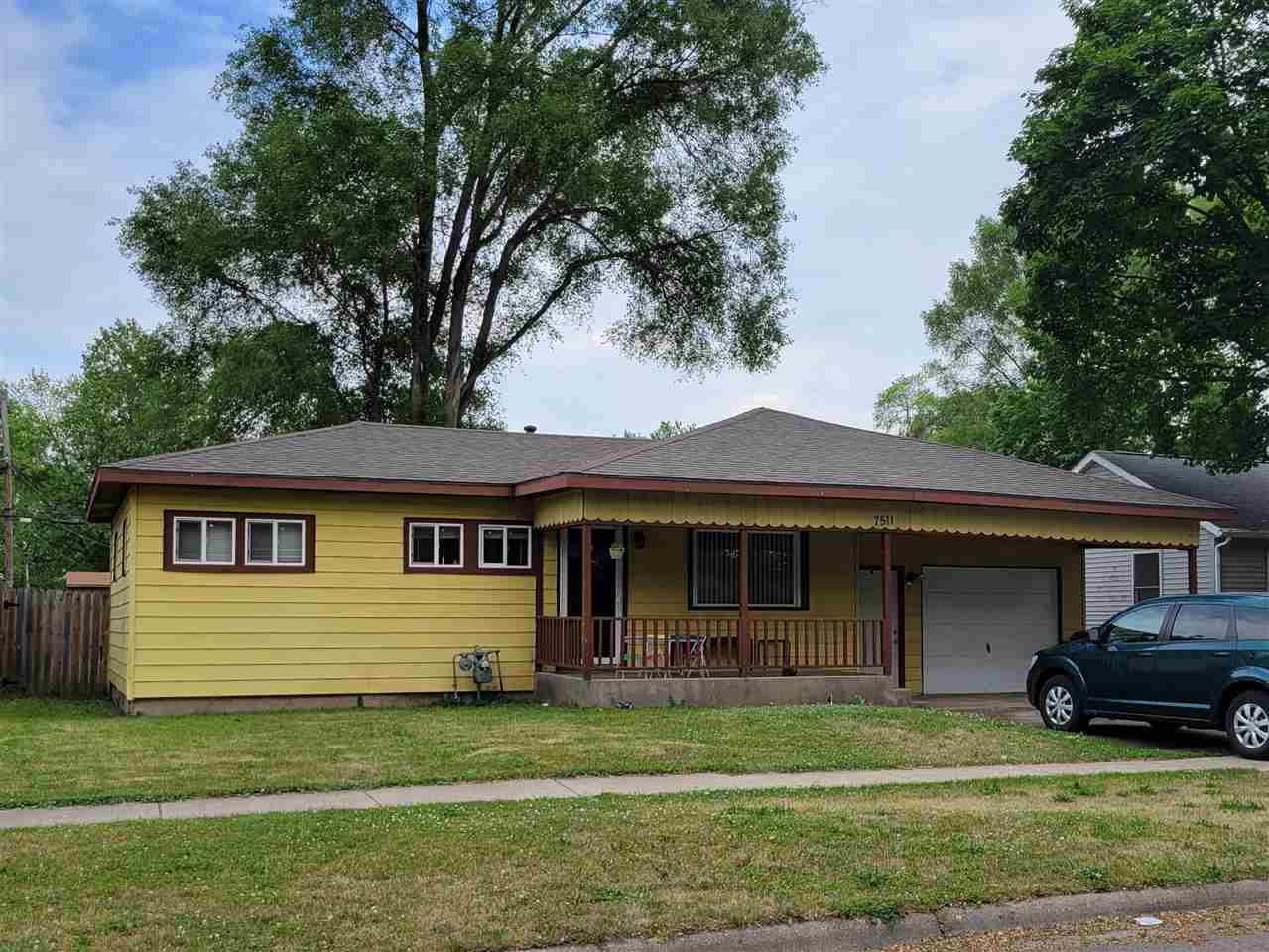 7511 Randy Road Machesney Park, IL 61115 - Photo 1 of 1 a front view of a house with a garden