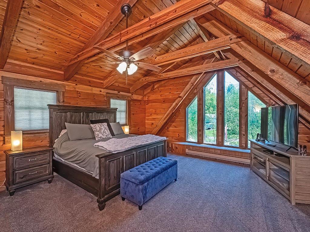 210 Edgewater Drive Monaca, PA 15061 - Photo 35 of 47 a bed sitting in a room next to a balcony