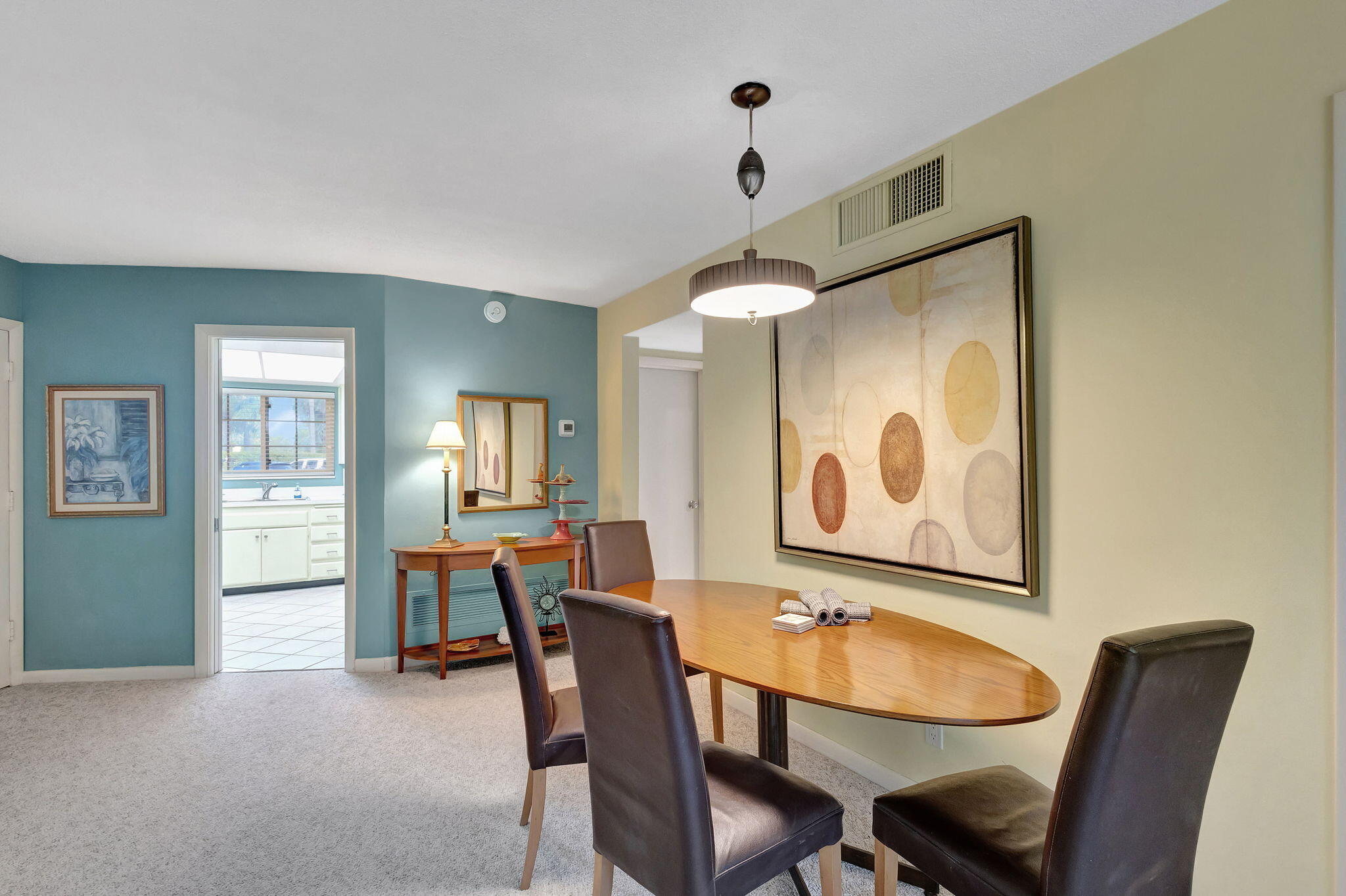 50 Celestial Way, Unit 108 Juno Beach, FL 33408 - Photo 11 of 54 a view of a dining room with furniture and chandelier