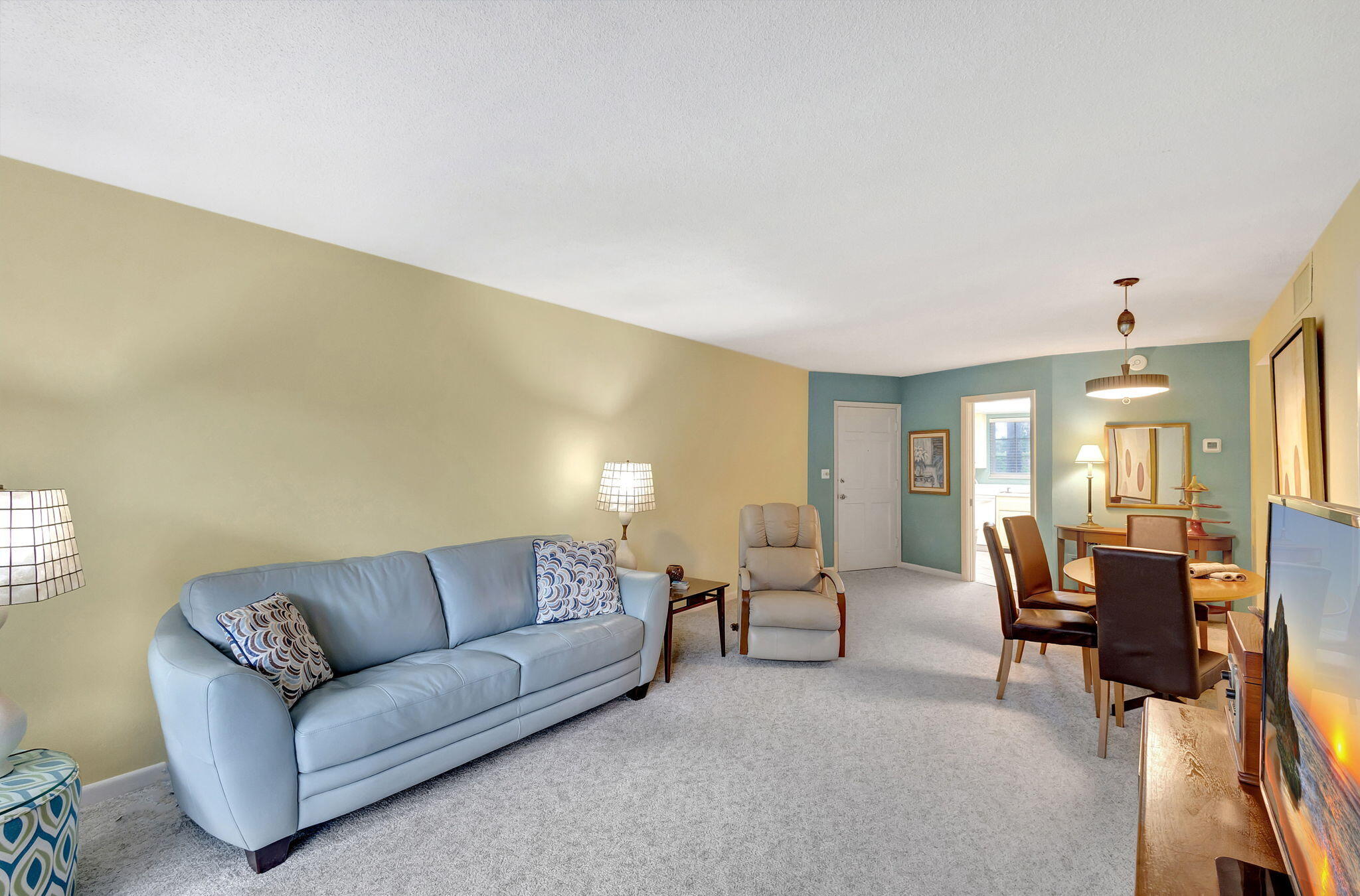 50 Celestial Way, Unit 108 Juno Beach, FL 33408 - Photo 15 of 54 a living room with furniture and dining table