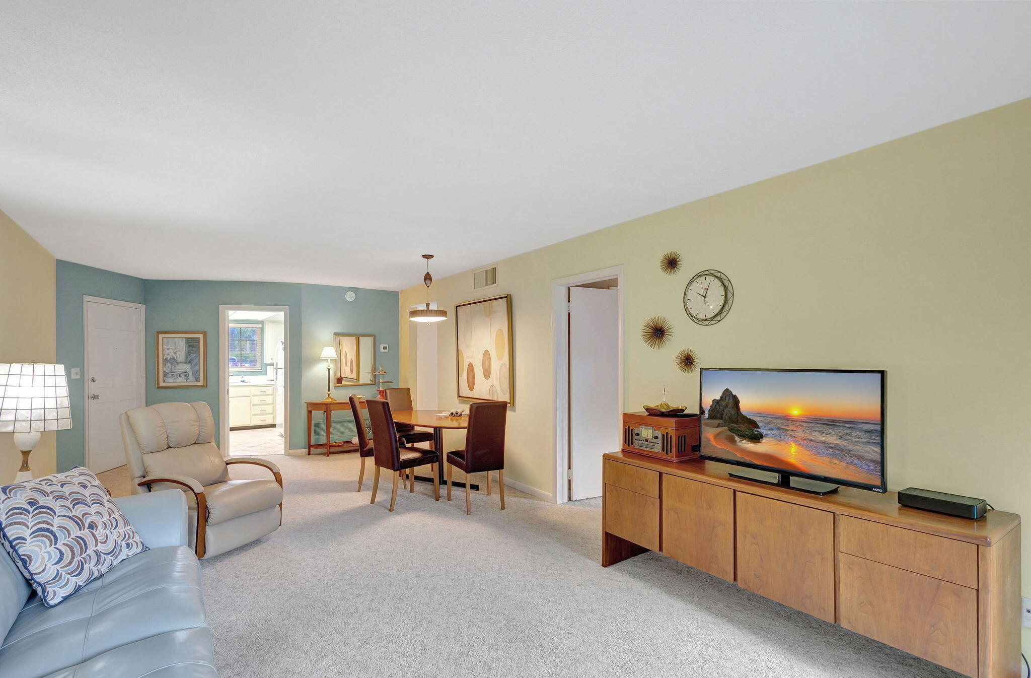 50 Celestial Way, Unit 108 Juno Beach, FL 33408 - Photo 16 of 54 a living room with furniture and a flat screen tv