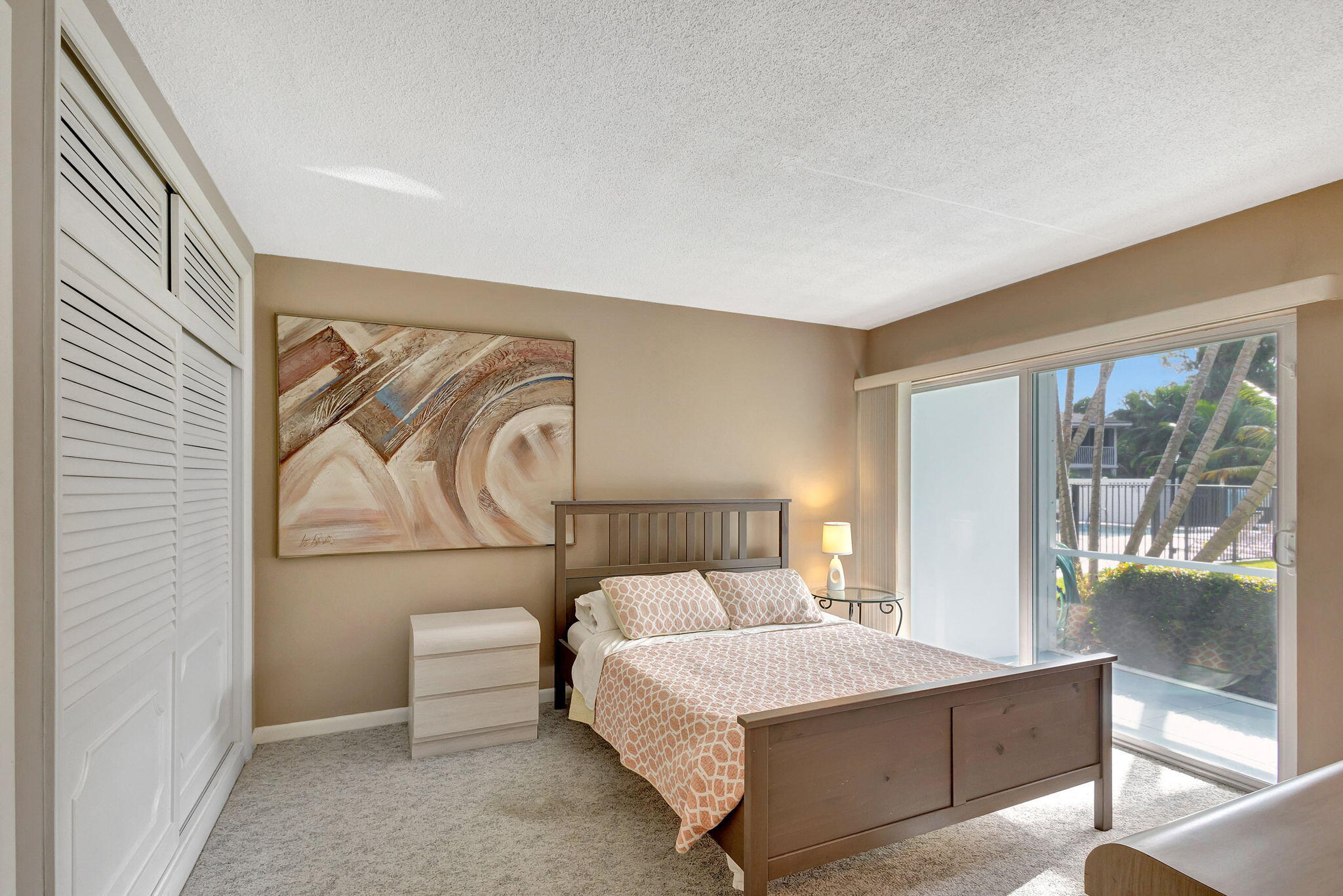 50 Celestial Way, Unit 108 Juno Beach, FL 33408 - Photo 22 of 54 a bedroom with a bed and window