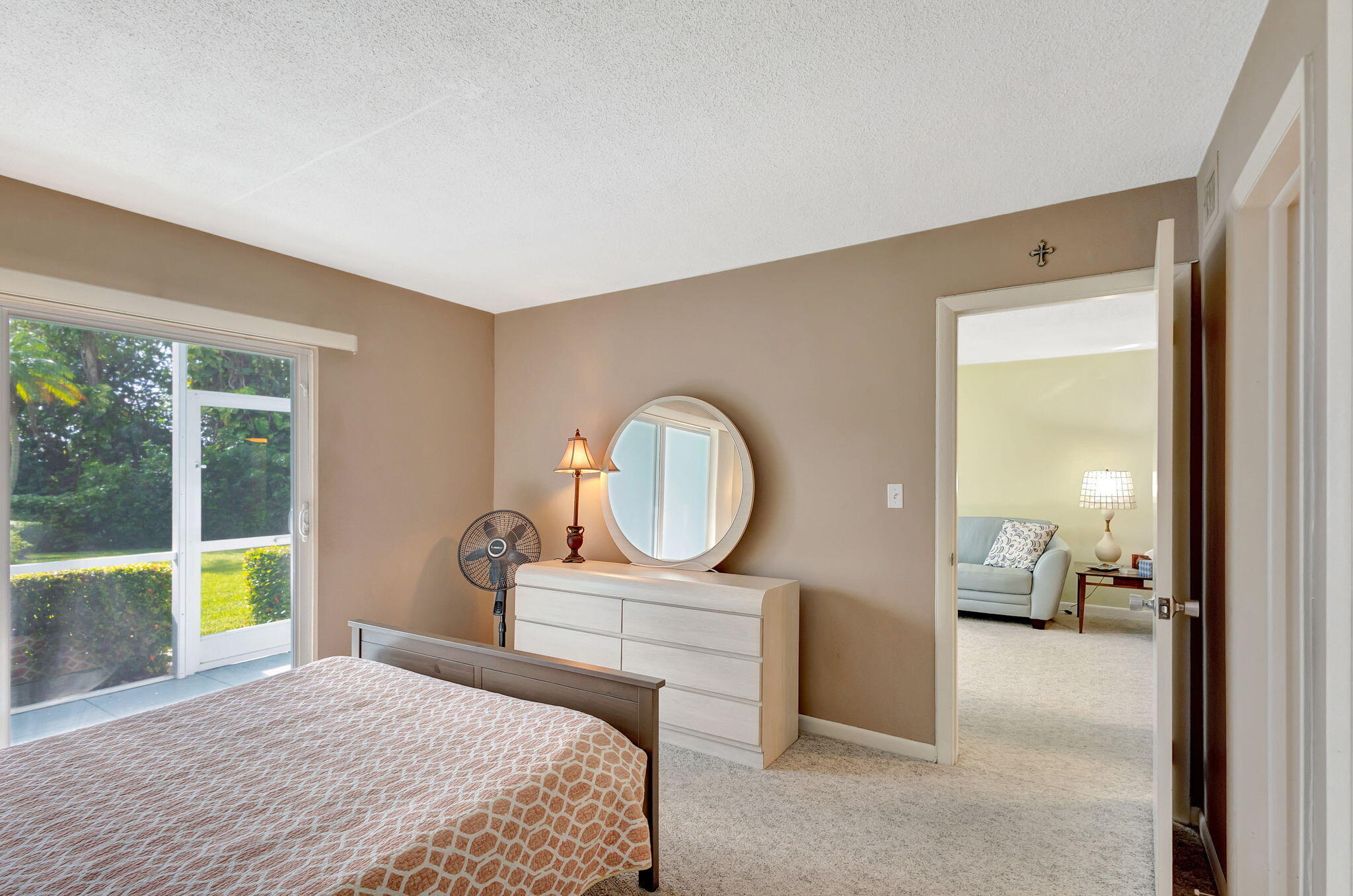 50 Celestial Way, Unit 108 Juno Beach, FL 33408 - Photo 23 of 54 a bedroom with a bed and a large window