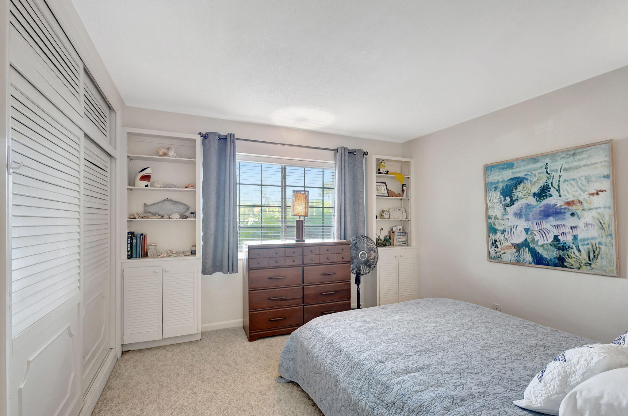 50 Celestial Way, Unit 108 Juno Beach, FL 33408 - Photo 27 of 54 a bedroom with a bed and a large window