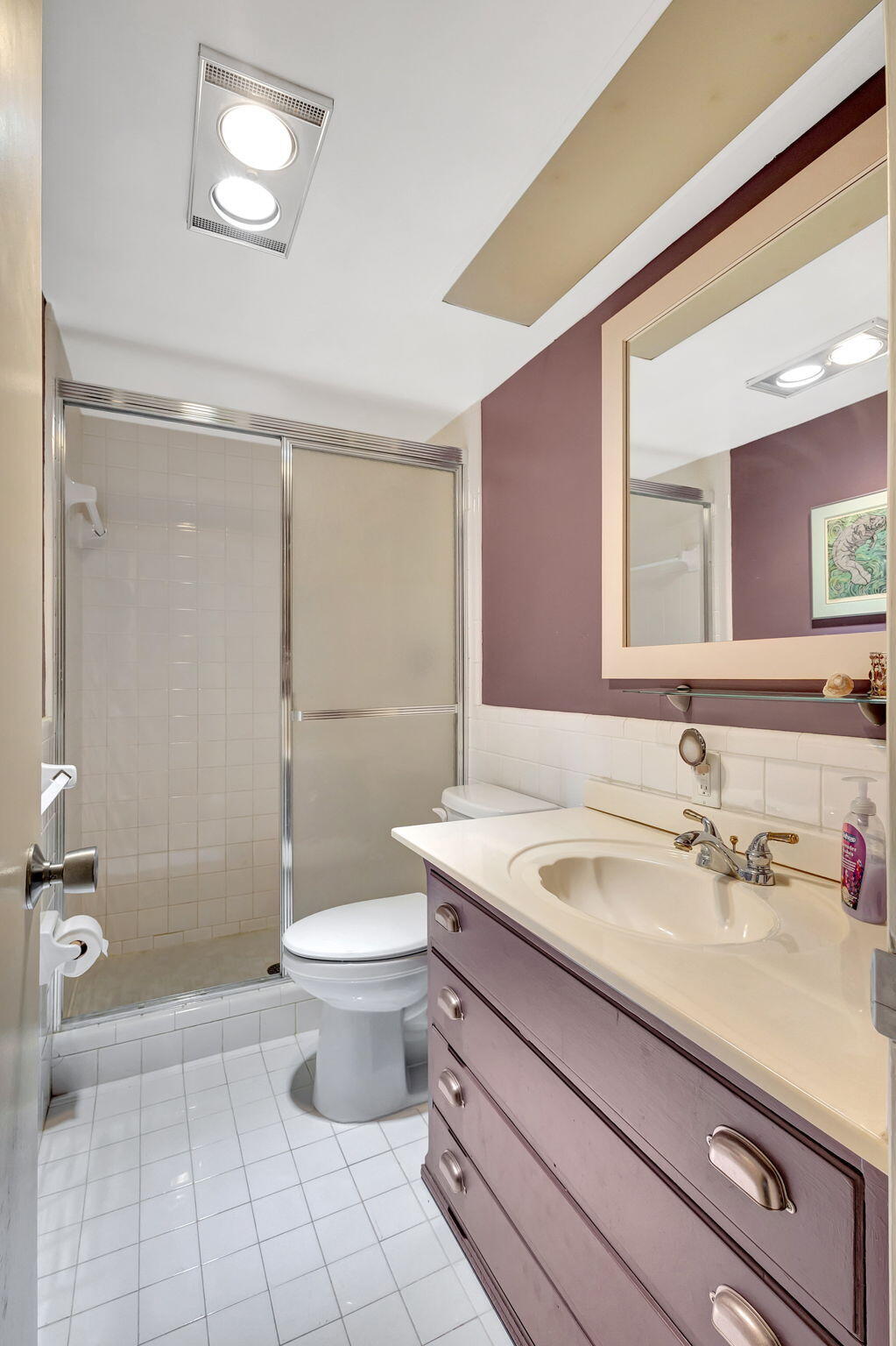 50 Celestial Way, Unit 108 Juno Beach, FL 33408 - Photo 30 of 54 a bathroom with a sink a toilet and shower