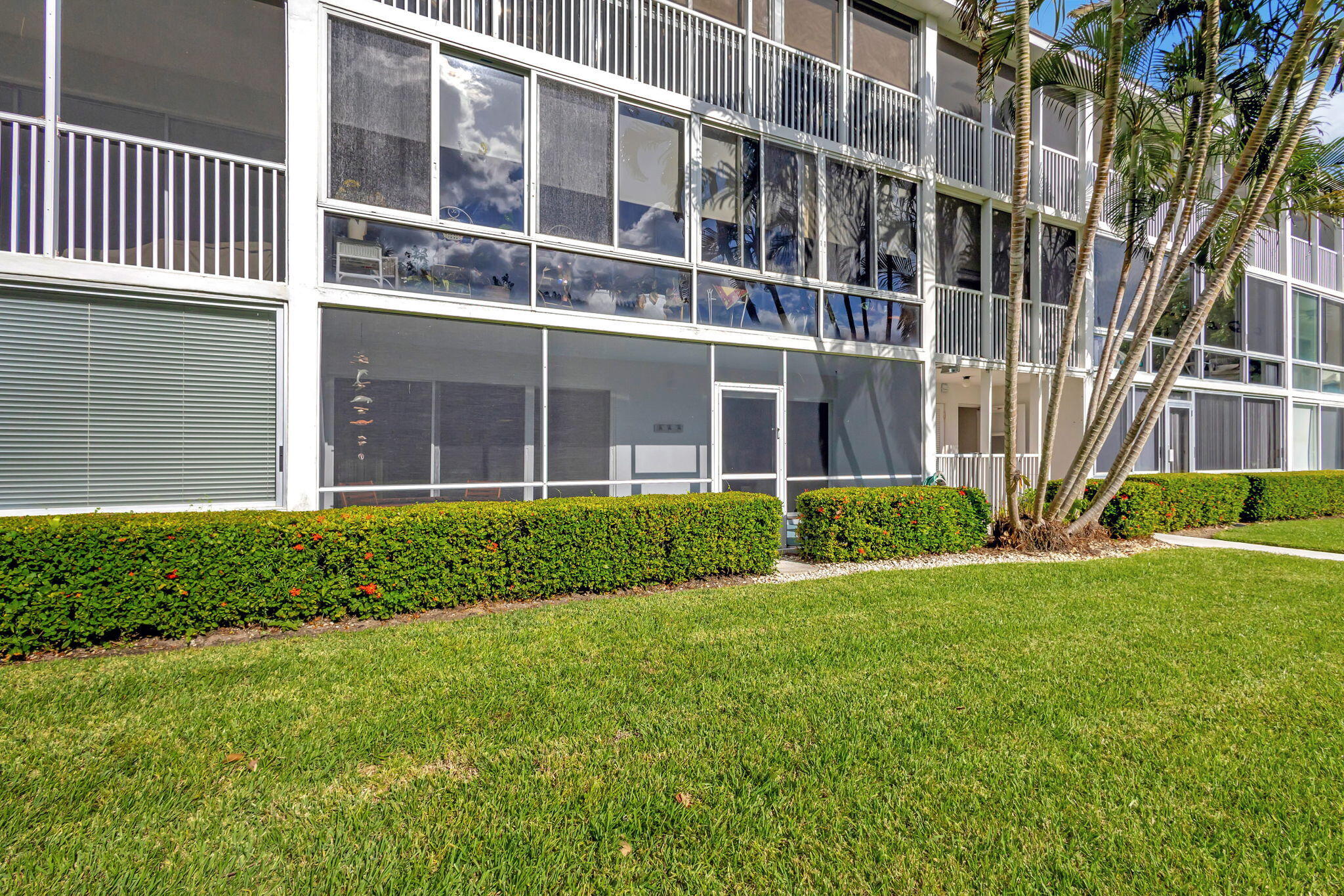 50 Celestial Way, Unit 108 Juno Beach, FL 33408 - Photo 35 of 54 a view of front a house with a yard