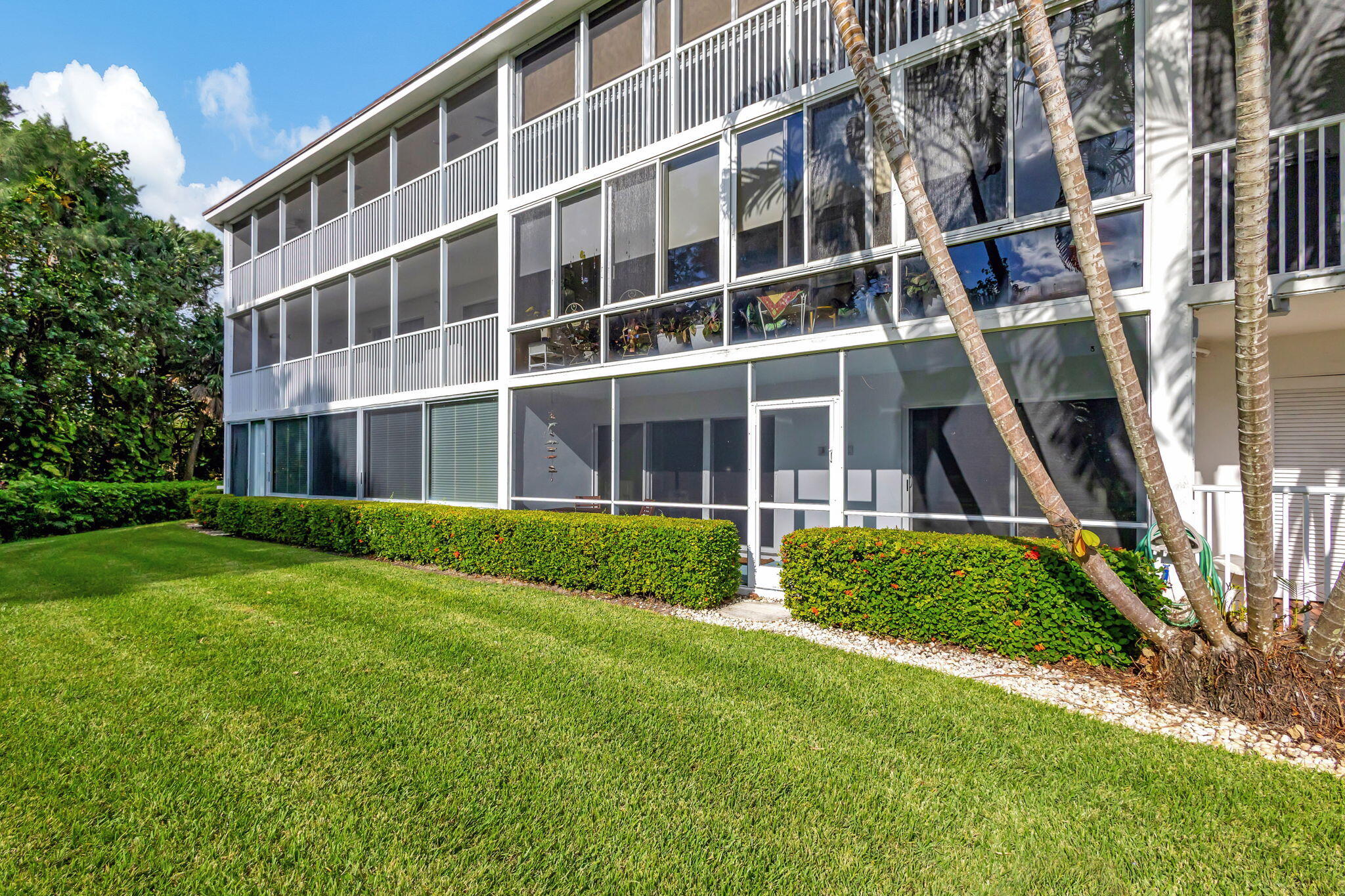 50 Celestial Way, Unit 108 Juno Beach, FL 33408 - Photo 37 of 54 a view of an apartment with a garden and plants