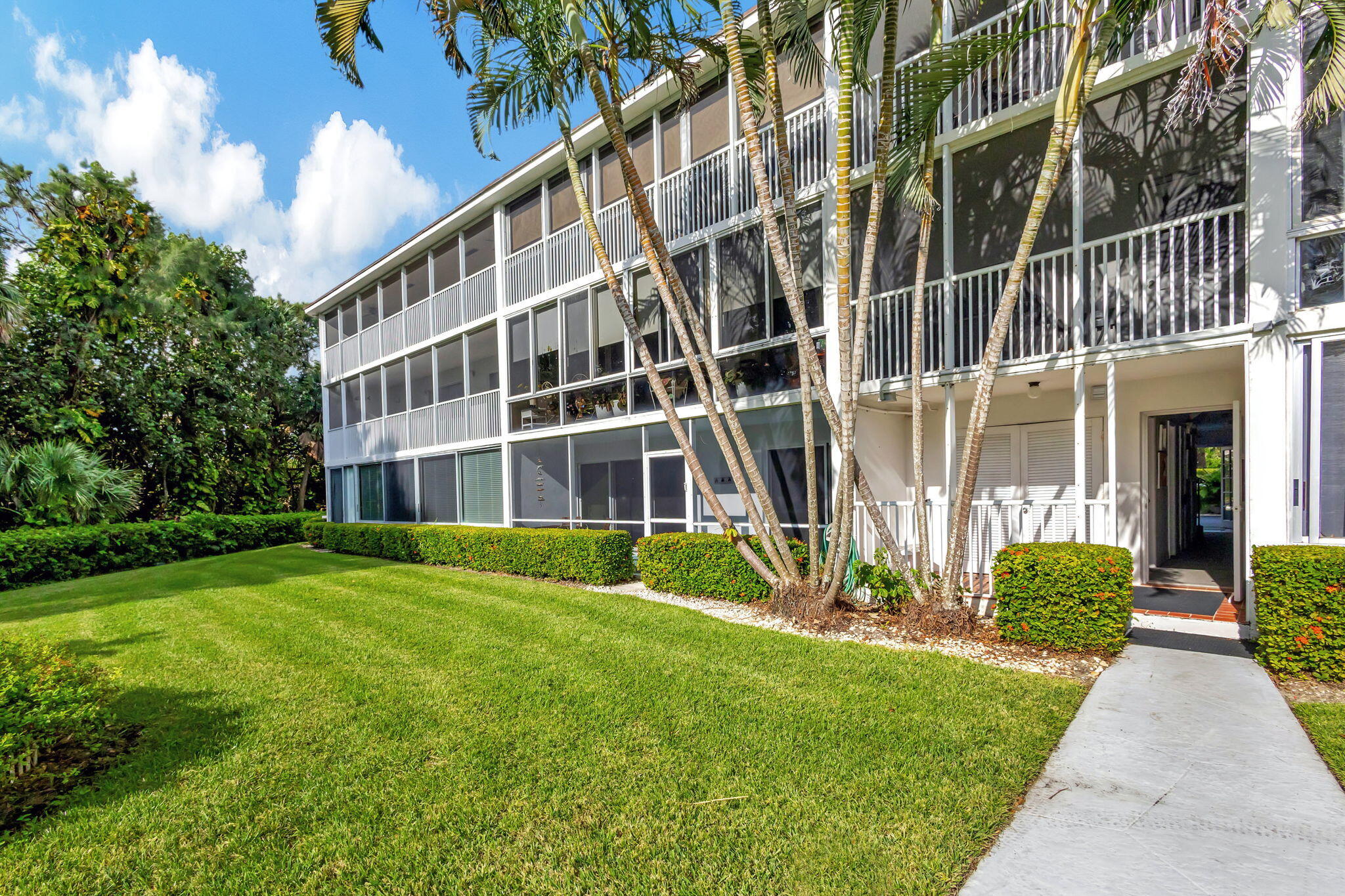 50 Celestial Way, Unit 108 Juno Beach, FL 33408 - Photo 38 of 54 a view of a building with a yard