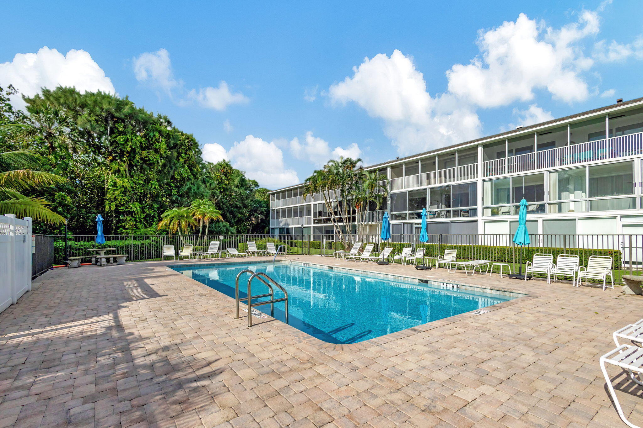 50 Celestial Way, Unit 108 Juno Beach, FL 33408 - Photo 39 of 54 a view of a swimming pool with a patio