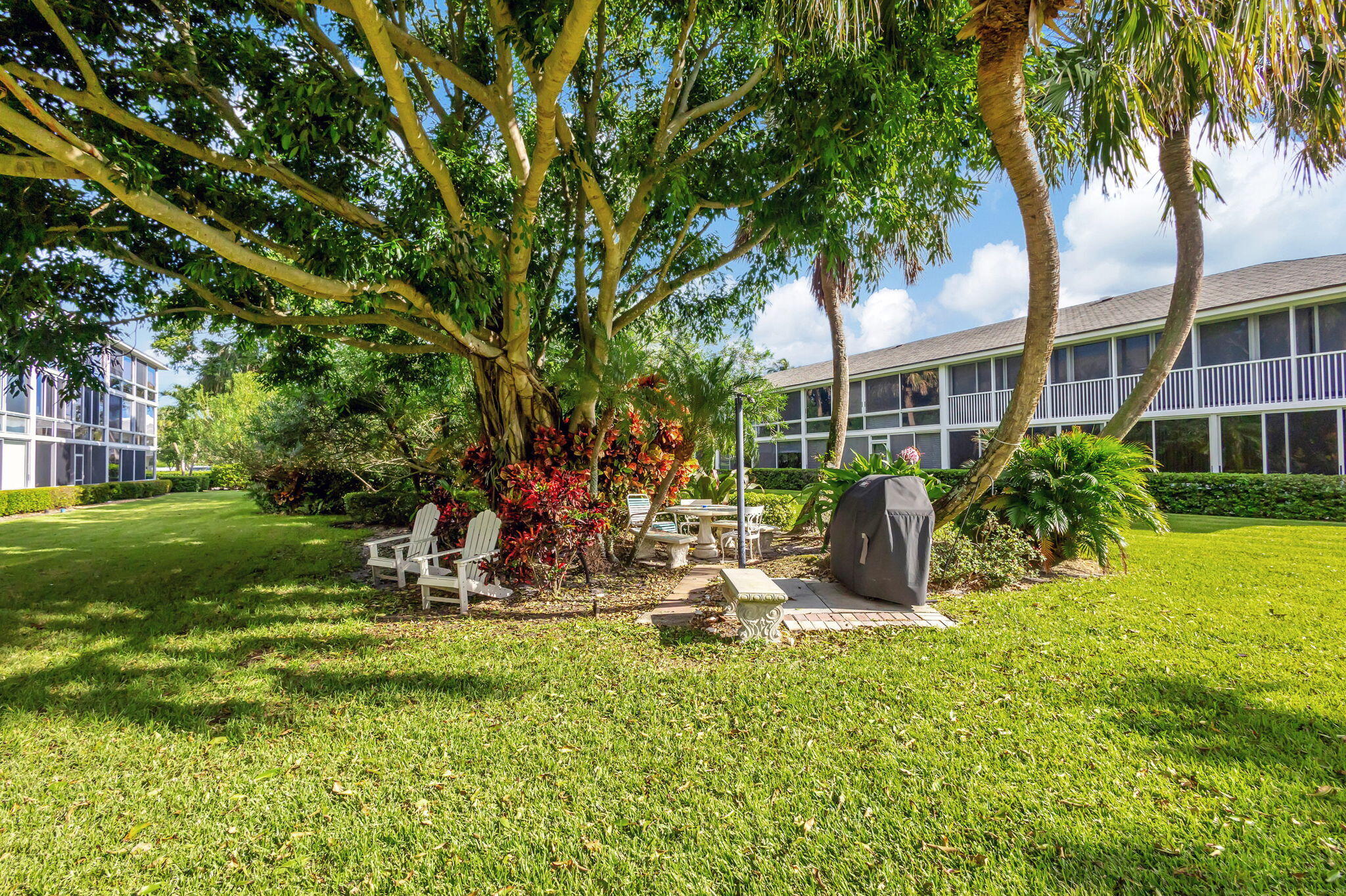 50 Celestial Way, Unit 108 Juno Beach, FL 33408 - Photo 41 of 54 a view of a backyard with a patio