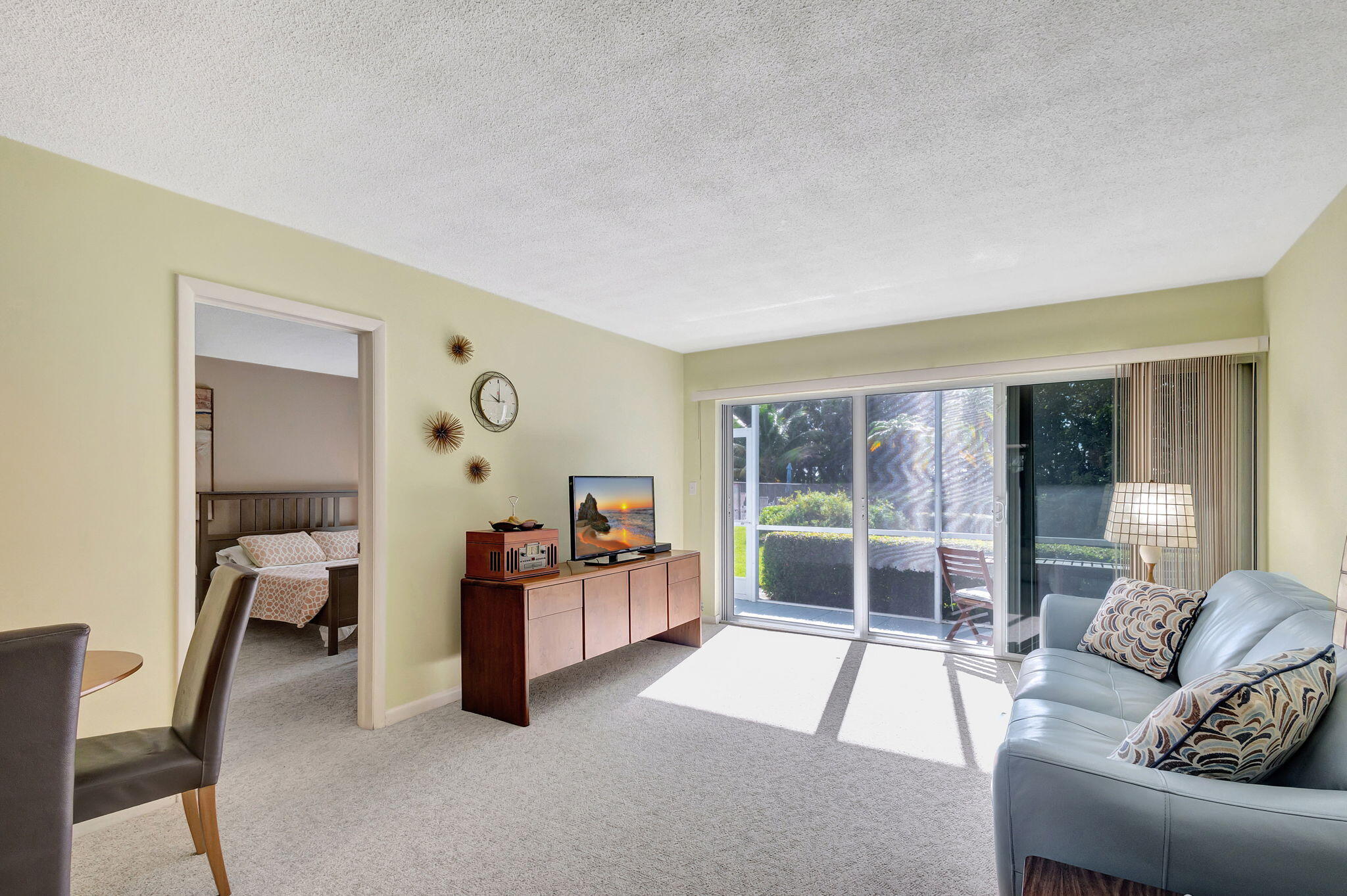 50 Celestial Way, Unit 108 Juno Beach, FL 33408 - Photo 5 of 54 a living room with furniture and large windows