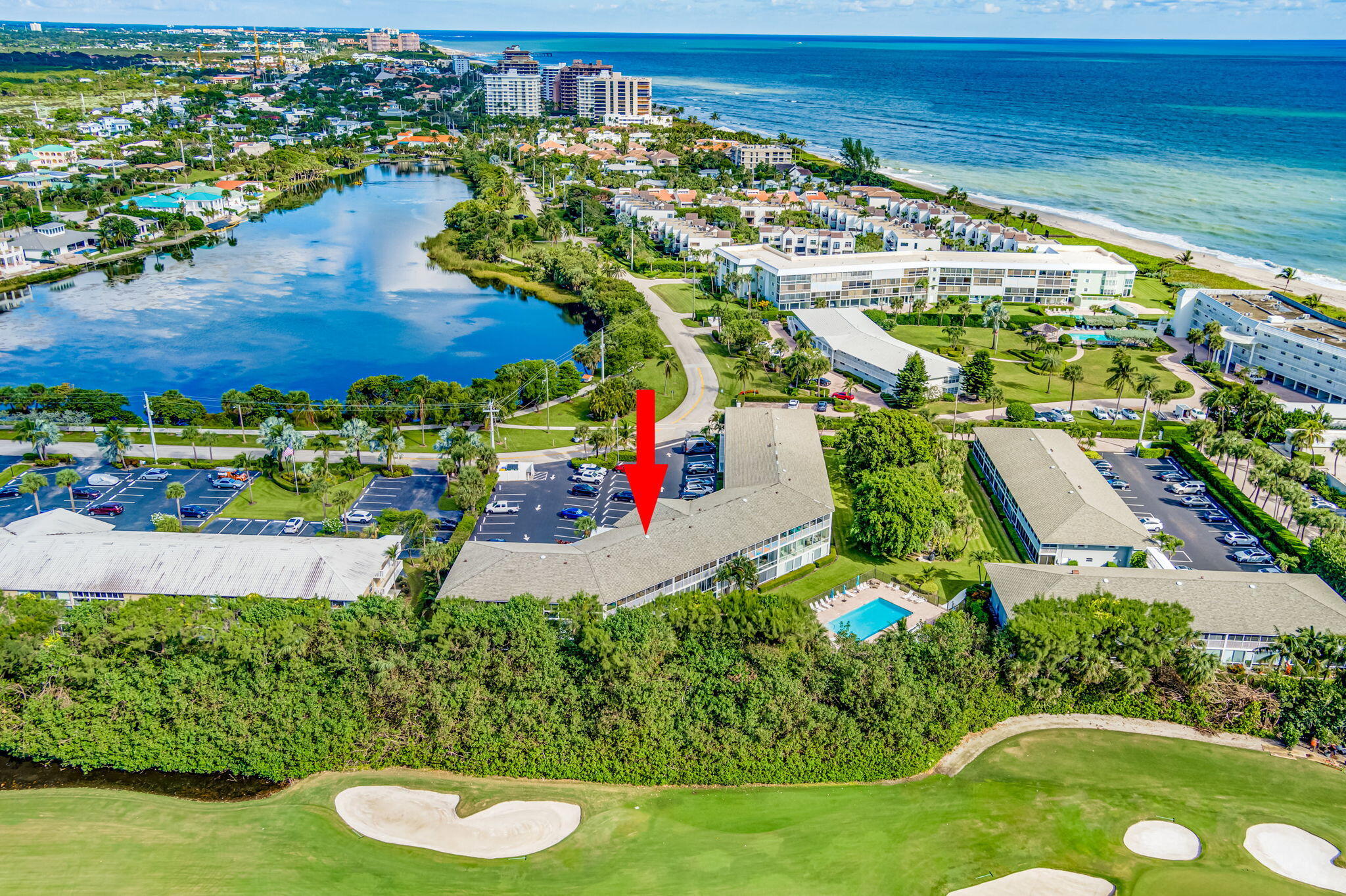 50 Celestial Way, Unit 108 Juno Beach, FL 33408 - Photo 52 of 54 an aerial view of residential houses with outdoor space and swimming pool