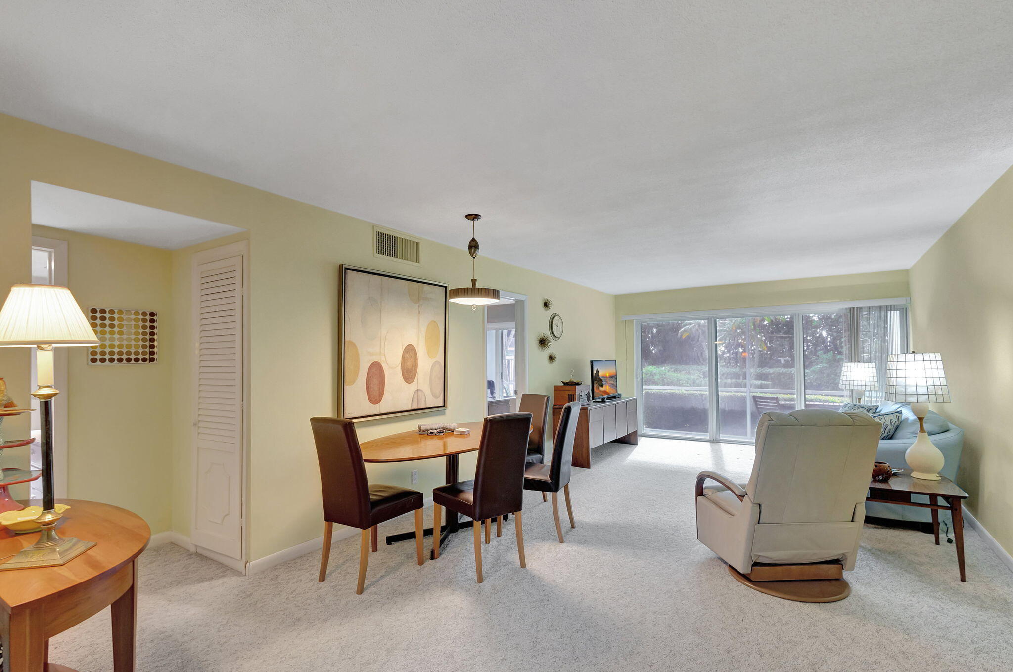 50 Celestial Way, Unit 108 Juno Beach, FL 33408 - Photo 8 of 54 a view of a dining room with furniture and a window
