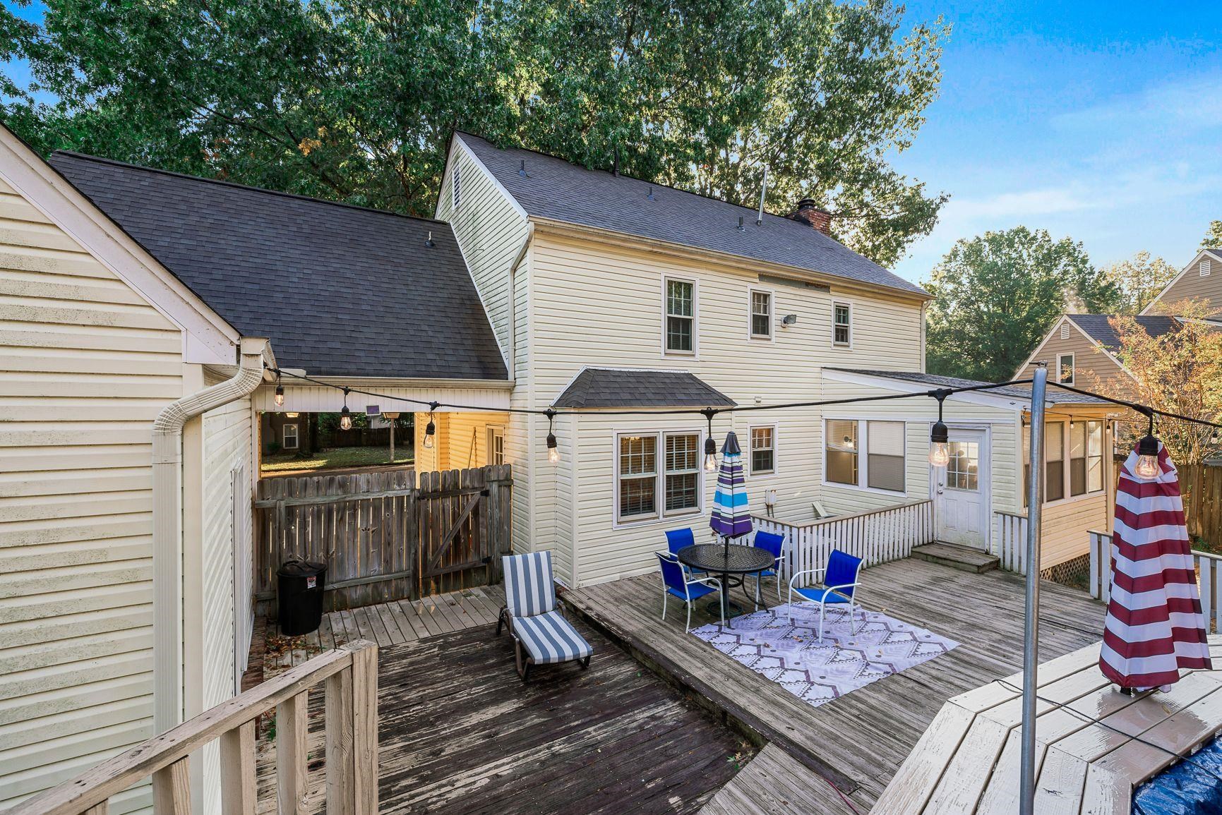 429 Dove Valley Road Collierville, TN 38017 - Photo 2 of 24 a view of a patio with table and chairs under an umbrella