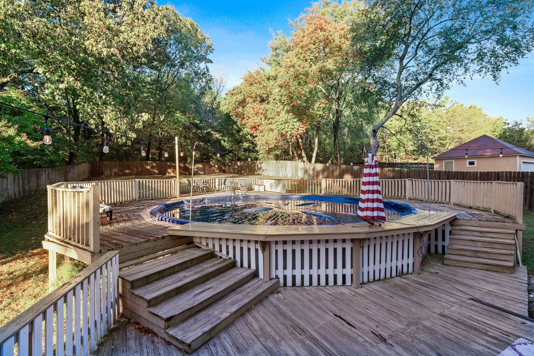 429 Dove Valley Road Collierville, TN 38017 - Photo 3 of 24 a view of a wooden deck and a patio