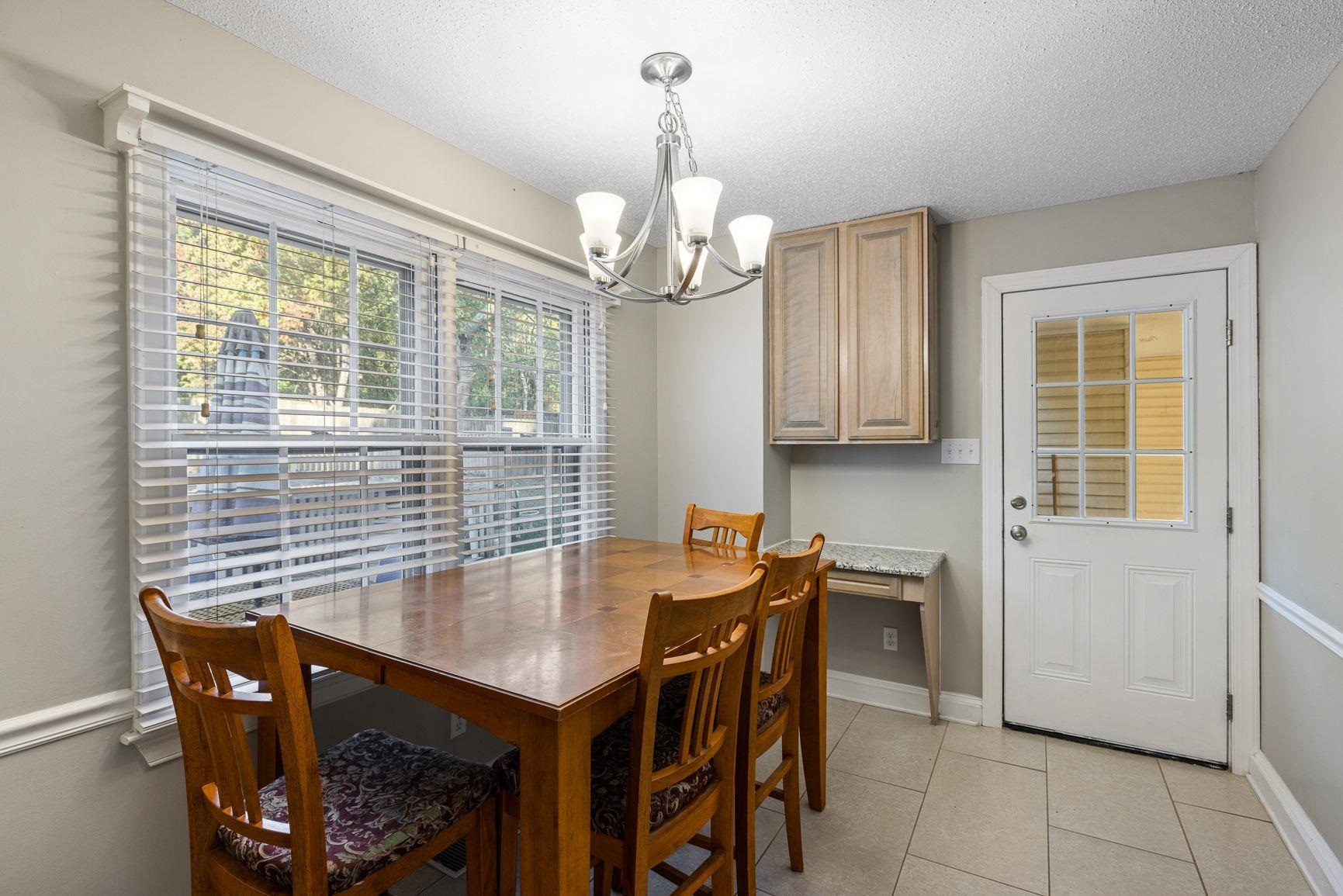 429 Dove Valley Road Collierville, TN 38017 - Photo 5 of 24 a view of a dining room with furniture and window
