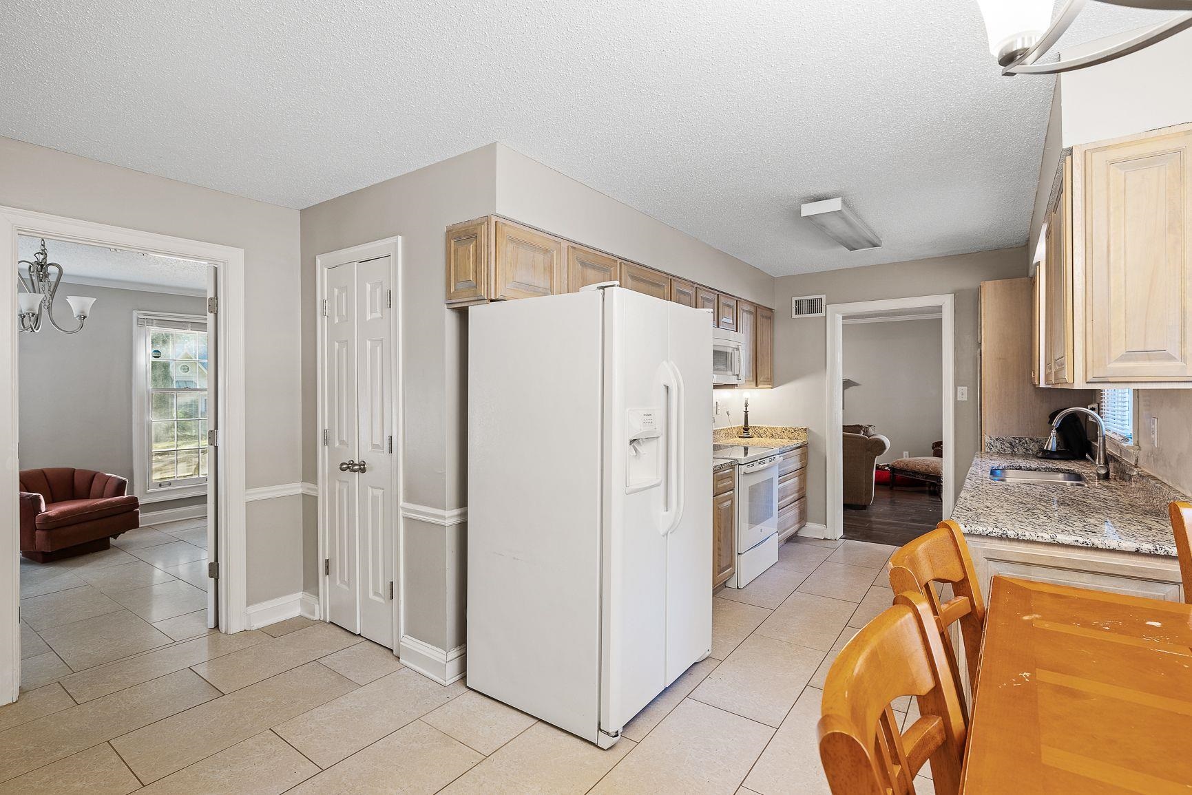 429 Dove Valley Road Collierville, TN 38017 - Photo 6 of 24 a kitchen with stainless steel appliances granite countertop a refrigerator and a sink