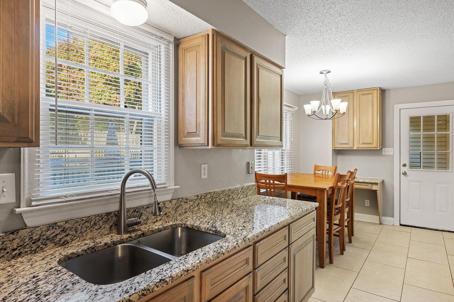 429 Dove Valley Road Collierville, TN 38017 - Photo 10 of 24 a kitchen with a sink and a refrigerator