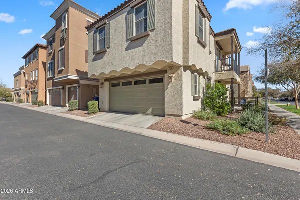 a view of a roof deck with couches chairs and wooden floor