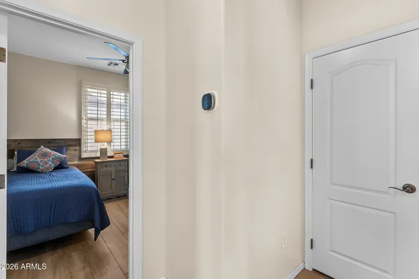a bedroom with two beds and a chandelier