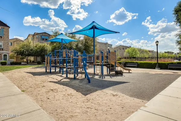 a bedroom with furniture and a flat screen tv