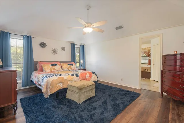 a spacious bathroom with a double vanity sink mirror and toilet