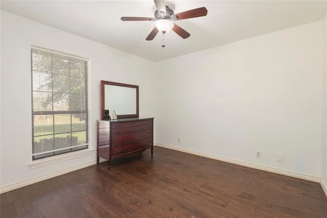 a bathroom with a sink mirror vanity and toilet
