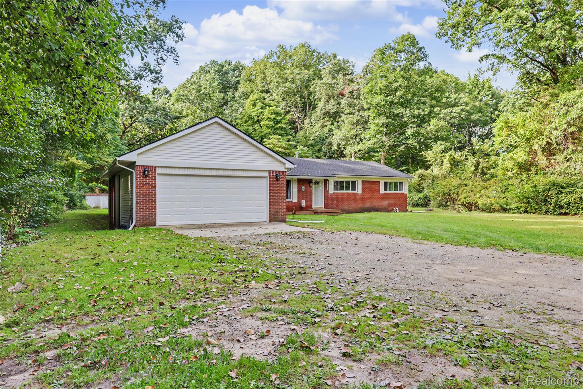 45223 Wear Road Belleville, MI 48111 - Photo 3 of 60 Red brick exterior with white trim