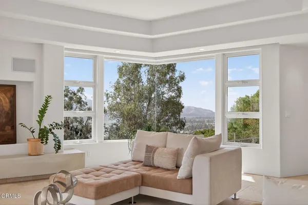 a view of a city with mountains in the background