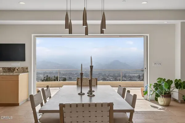 a kitchen with stainless steel appliances granite countertop a sink and a refrigerator