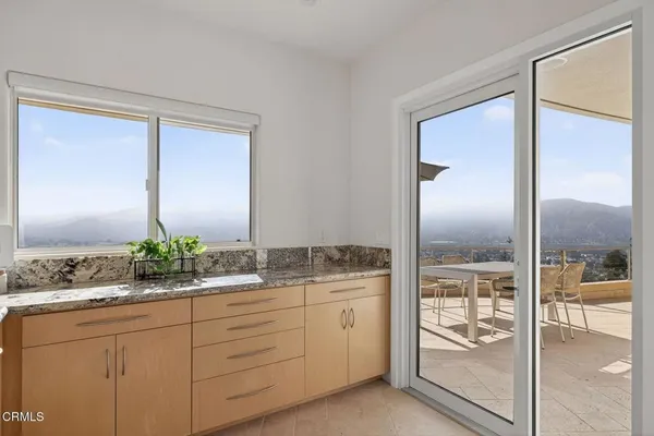 a patio with a table and chairs