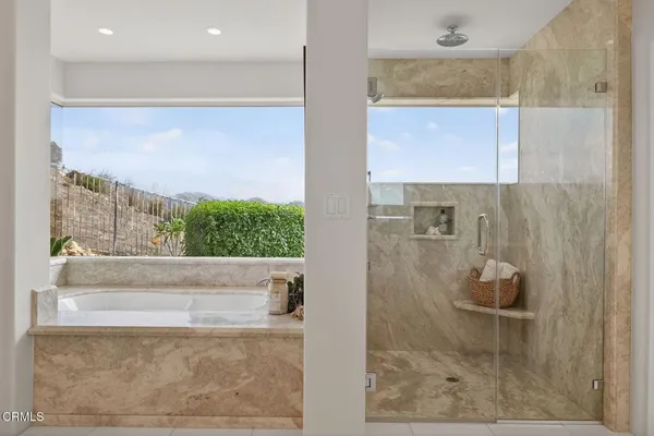 a bathroom with double sink and a mirror