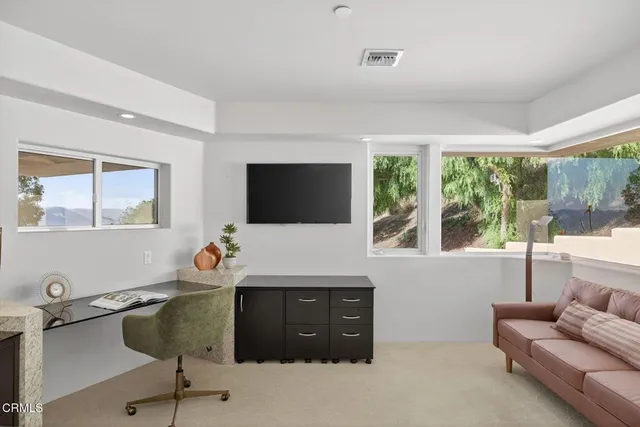 a kitchen with a refrigerator and cabinets