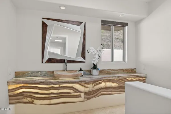 a kitchen with a refrigerator and cabinets