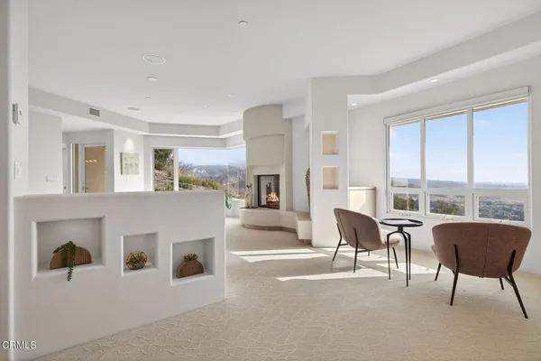 a view of livingroom and kitchen with furniture