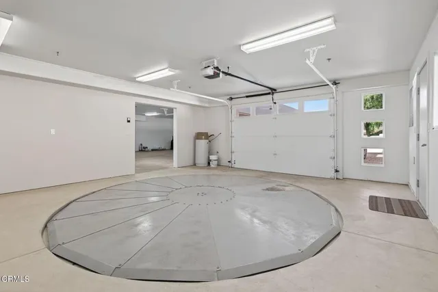 an aerial view of residential house and sandy dunes