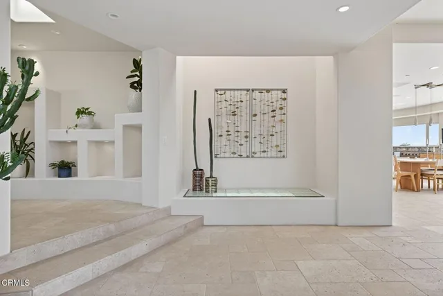 a living room with couch and a window