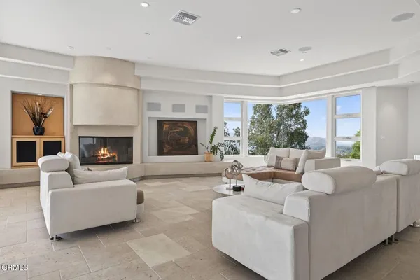 a living room with couch and a window