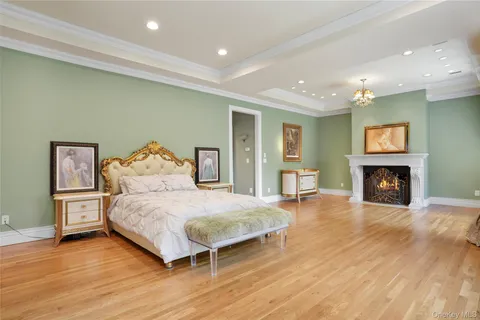 a bedroom with a bed and a fireplace